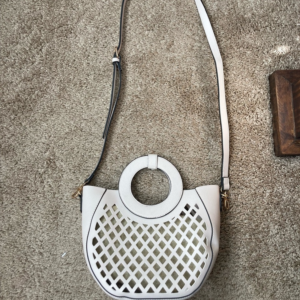 Cream/white purse with tan zipper pouch inside